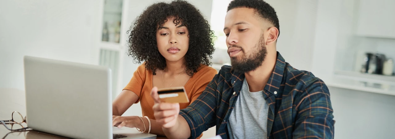 couple reviewing debt management options